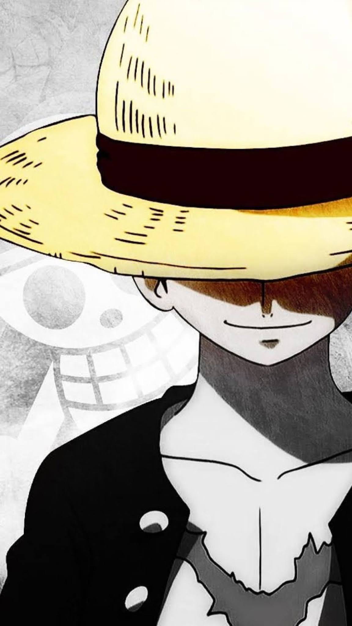 Ảnh nền Luffy bên cạnh hình đầu lâu One Piece.