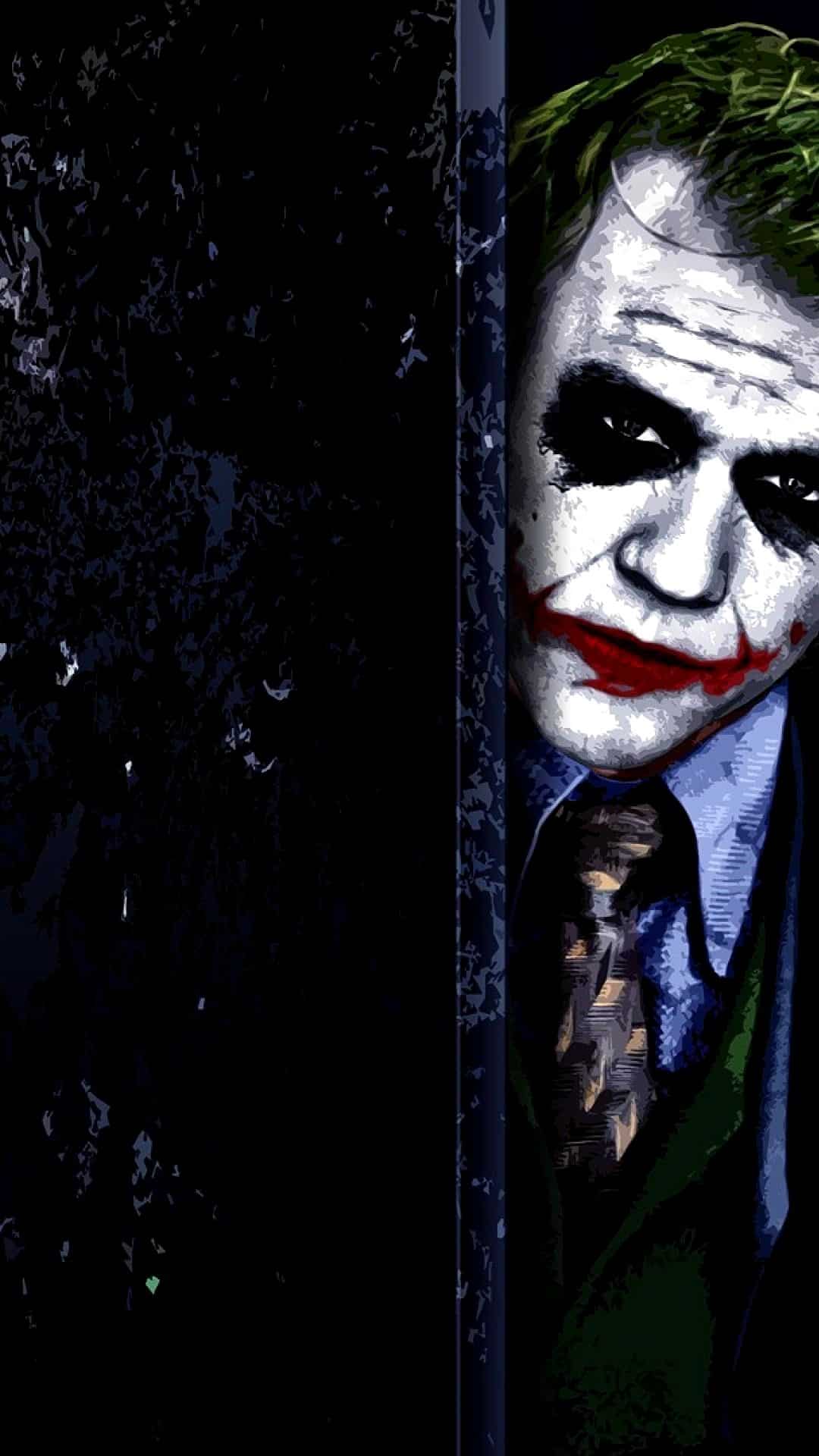 Hình Joker buồn đứng dựa mặt vào tường.